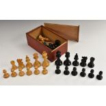 A boxwood and ebonised Staunton pattern weighted chess set, the Kings 8.