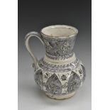 A Middle Eastern tin glazed earthenware baluster jug,