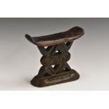 Tribal Art - a Shona headrest, pierced and carved geometric undertier, 16cm high,