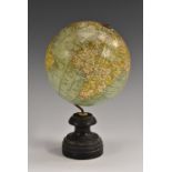 An early 20th century terrestrial globe, by C Thomas, Paris, turned ebonised base,