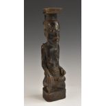 Tribal Art - a Kuba Ndop figure, carved as a portrait of a king, depicted seated,