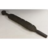 Tribal Art - a Tuareg tent peg, carved with bands of geometric motifs,