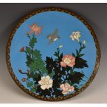 A Japanese cloisonne circular charger, decorated in polychrome with chrysanthemums and a bird,