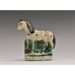 A Staffordshire pottery equine model, of a dappled horse, oval base, 10cm high, c.