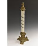 An unusual 19th century gilt metal and opaque glass table lamp, the column with entwined snake,