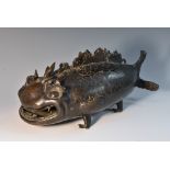 A Japanese dark patinated bronze koro, amusingly cast as a koi carp, loose fitting cover, 30cm long,