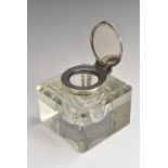 A large Victorian silver mounted clear glass square desk inkwell, hinged cover, 9cm wide,