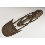 Tribal Art - a Papua New Guinea figural food hook, typically carved and set with cowrie shells,