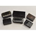 An early 19th century papier-mâché rounded rectangular snuff box, pressed patera cover,