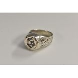 A Turkish silver and niello gentleman's signet ring, decorated with star and crescent,