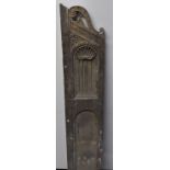 A 17th century Baroque oak pew end, scroll cresting above a niche crested by a shell, 148cm high, c.
