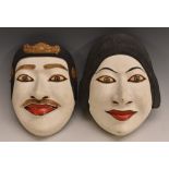 A pair of Japanese carved and painted noh masks, 20.