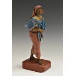 An Indian composition figure, of a female peasant carrying her child,