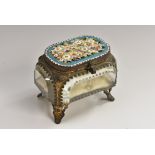 An Italian micromosaic jewel casket, hinged cover decorated in coloured tesserae with flowers,