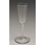 A George III opaque twist wine glass, tall funnel shaped bowl, double-helix stem,
