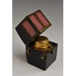 A 19th century novelty morrocco leather inkwell, as a sedan chair, hinged cover, 10cm high, c.