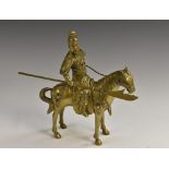 A Chinese brass equestrian group, of a warrior on horseback, picked out with jewelled stones,