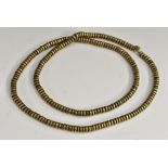 Tribal Art - a string of African patinated bronze 'donut' beads,
