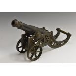 An early 20th century bronze and cast iron desk model signal cannon,