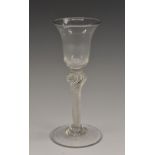 A George III air twist drinking glass, bell shaped bowl, knopped stem, domed circular foot, 15.