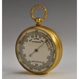 A gilt brass aneroid pocket barometer, 4.