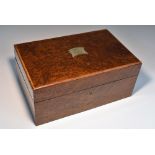 An amboyna rectangular cigar humidor, hinged cover enclosing a fitted interior,