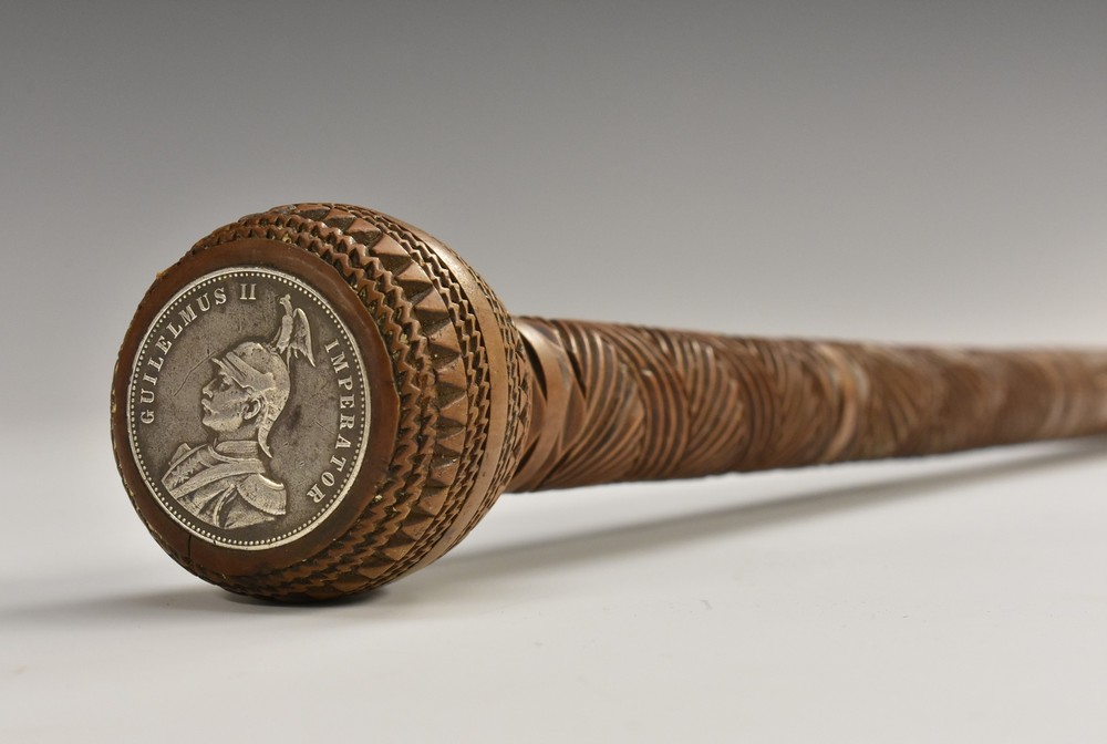 A 19th century Colonial hardwood gentleman's walking cane, chip carved with geometric motifs,