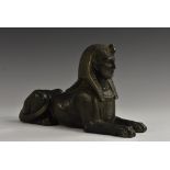 A 19th century French bronzed gun metal mantel model, of an Egyptian sphinx,