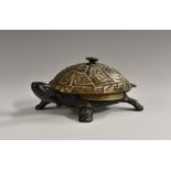 An early 20th century German cast iron novelty desk or table bell, cast as a tortoise,