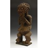 Tribal Art - a Mabila tadep figure, typically standing with legs crooked,