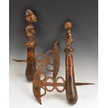 Tribal Art - an African axe, shaped and pierced blade, the club shaped handle carved as a figure,