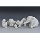 A Bernard Moore novelty miniature model of a seated elephant, glazed in white throughout,