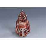 A Bernard Moore novelty miniature figure of a seated imp, mottled grey and flambé glaze, 6cm,