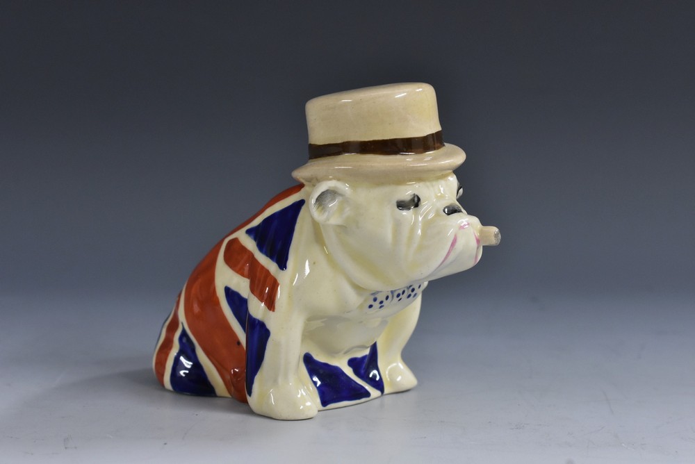 A Royal Doulton Churchill Bulldog, with cigar and top hat, wearing a union jack, 7.