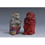 A Bernard Moore miniature model of a seated monkey, lustrous mottled grey glaze, glass bead eyes,