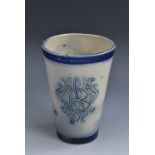 A Martin Brothers stoneware beaker, incised with monogram WMB, cobalt blue bands, 10.