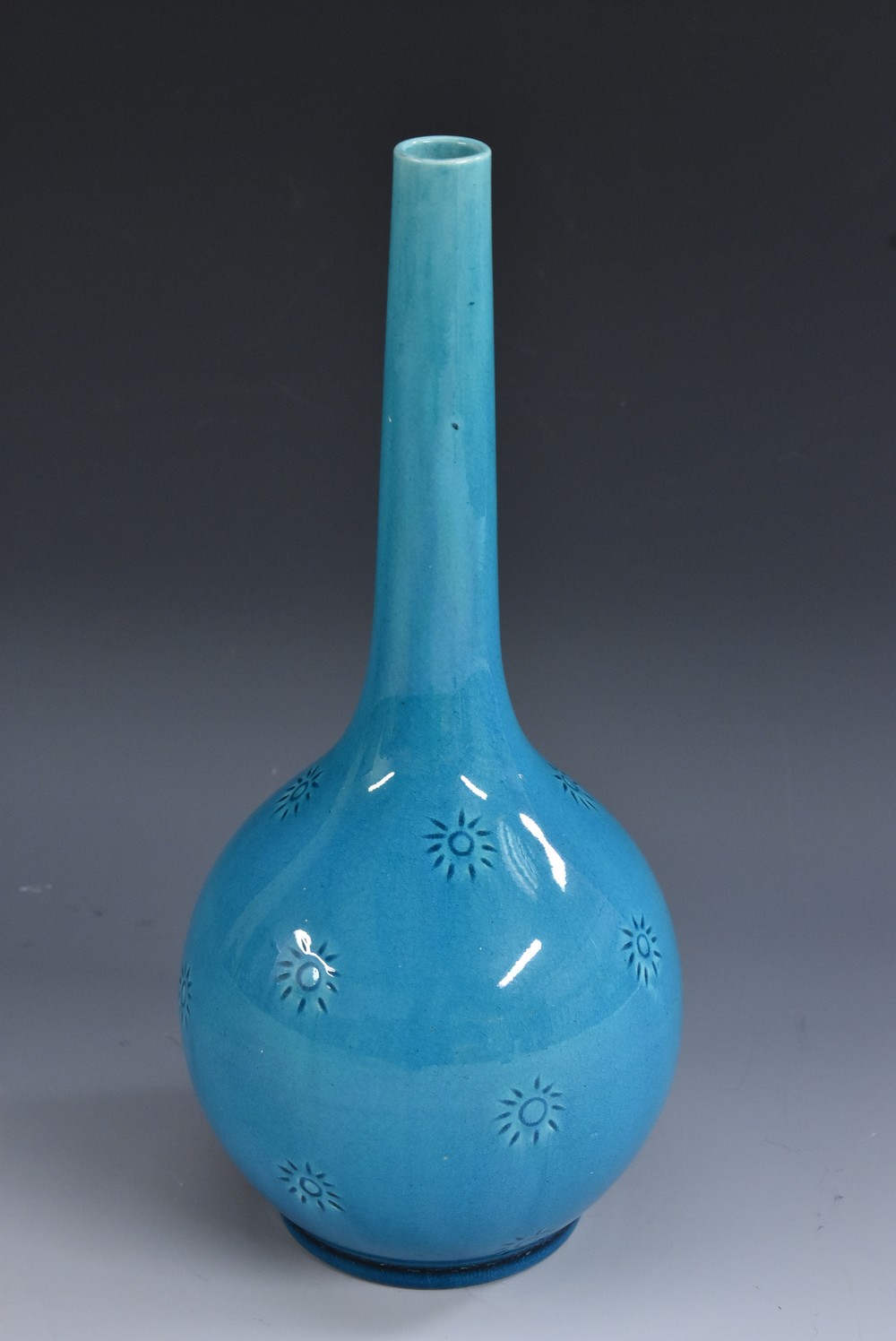 A Burmantofts gourd shaped bottle vase, slender elongated neck,