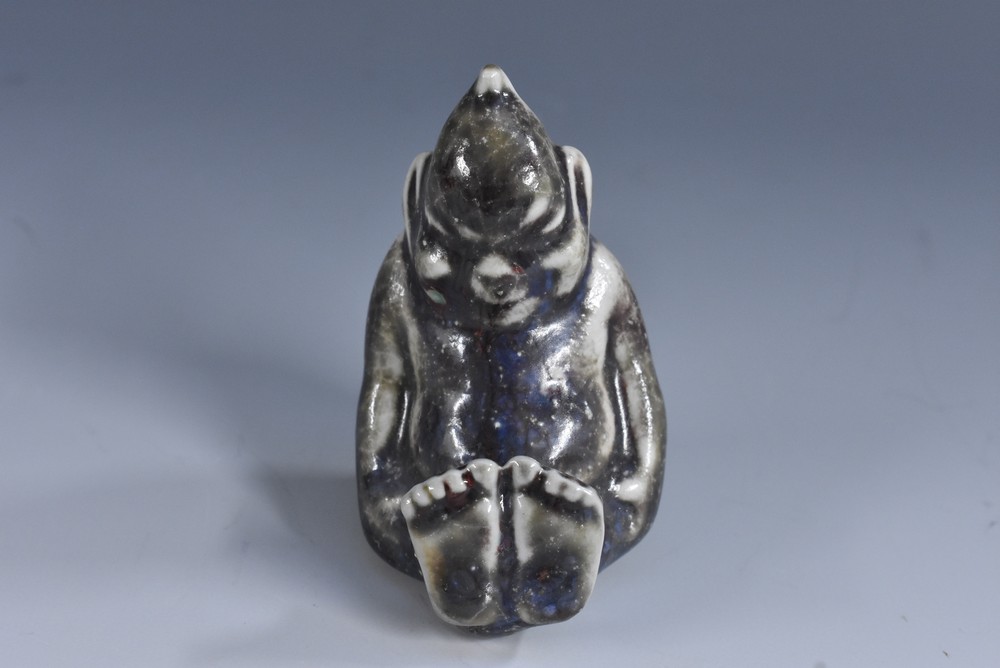 A Bernard Moore novelty miniature figure of a seated imp, mottled lustrous grey glaze, 6cm,