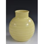 A Keith Murray for Wedgewood globular vase, incised linear decoration, pastel yellow glaze,