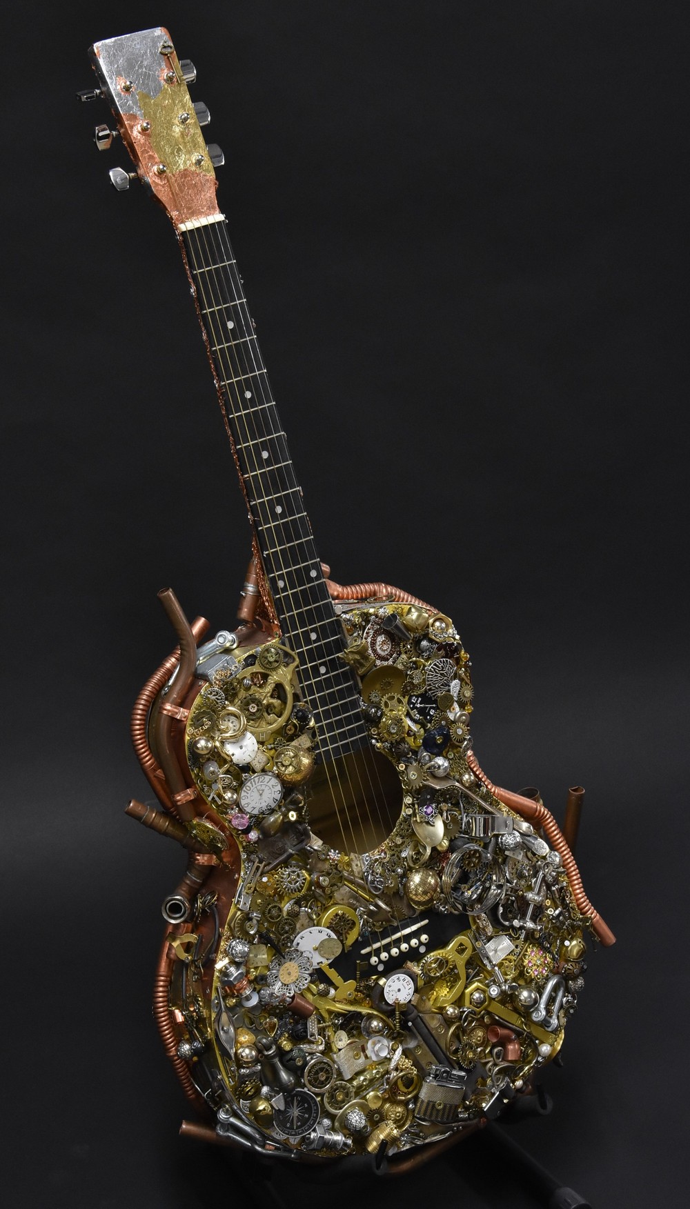 Steampunk Artwork - a bespoke full size acoustic guitar, typically applied with cogs, wheels,
