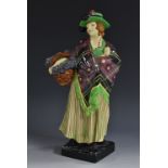 A Royal Doulton figure, Sweet Lavendar, designed by L Harradine, HN1373,