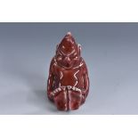 A Bernard Moore novelty miniature figure of a seated imp, mottled flambé glaze, 6cm,