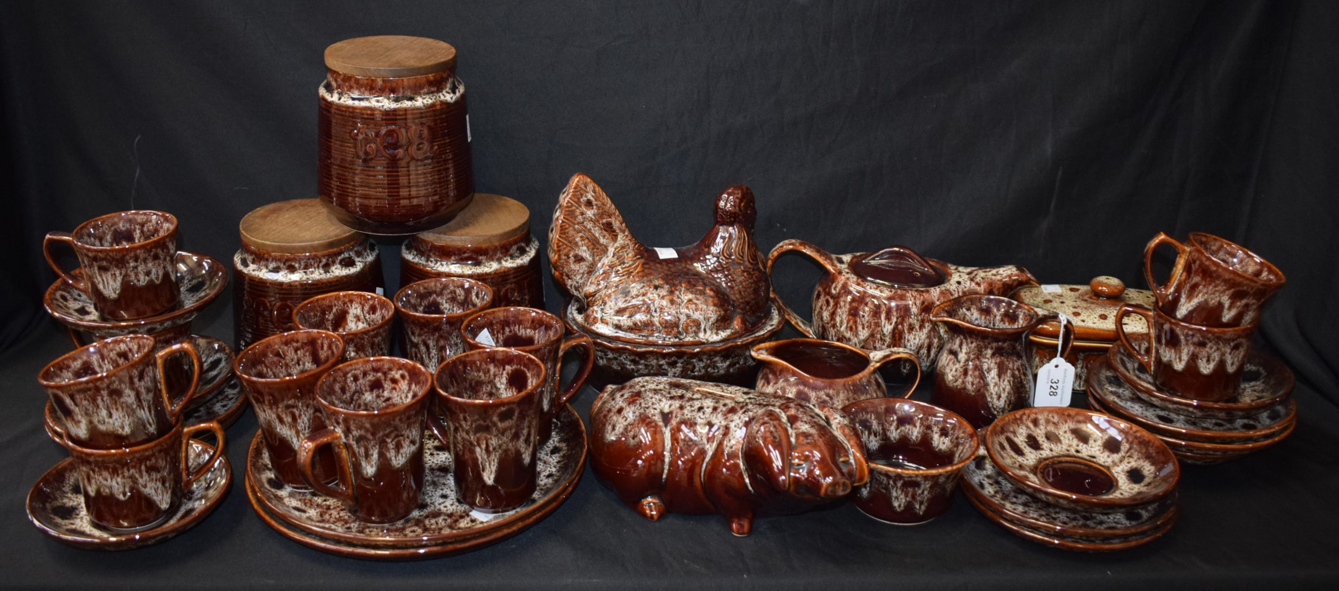 A Cornish Kernewek ceramic treacle glazed tea service, including teapot, cups and saucers,