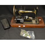 An early 20th century Singer sewing machine with Sew-Tric motor