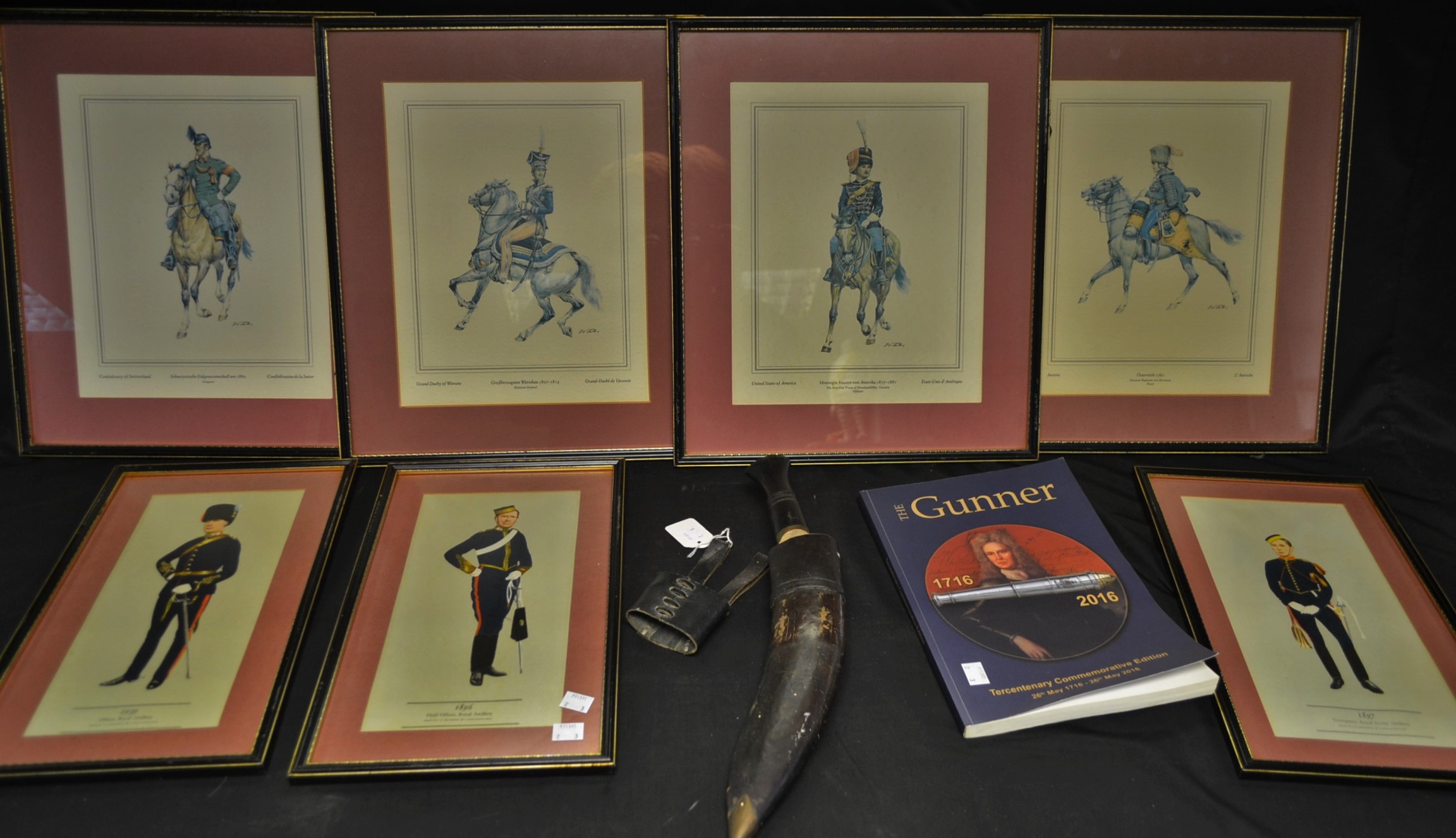 A kukri; a set of four Regimental cavalry prints; three others similar; a book,