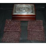 A silver mounted mahogany jewellery box, the silver cover embossed with roses and ribbon tied swags,