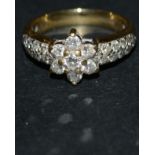 A diamond floral cluster ring