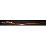 A Chinese carved walking stick, the terminal carved with an elder,