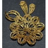 A South American Guyana gold coloured metal filigree flower brooch, 5.