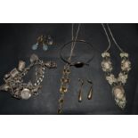 Jewellery - a silver charm bracelet and charms including typewrite, horse, champagne bottle,